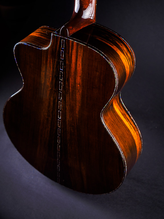 Old growth straight grained Brazilian rosewood with complementary blue abalone borders and center stripe